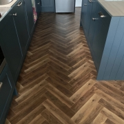 Lightly Smoked Oak Herringbone Laminate – 12mm – Water & Scratch Resistant – Wood Floor Store